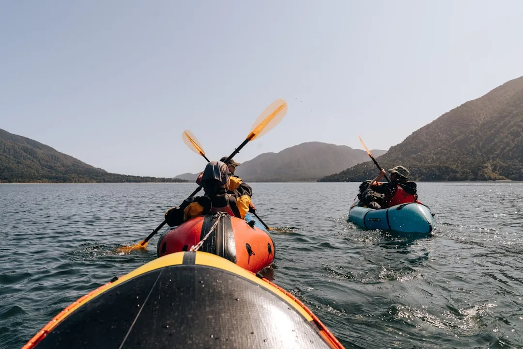 Hard-shell touring kayak cutting through water efficiently