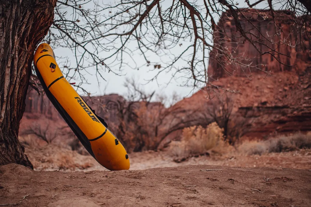 Kayaker paddling through serene waters on inflatable kayak