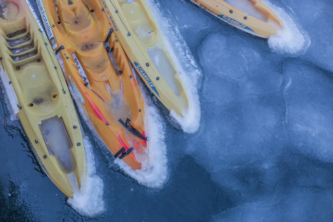 Kayaker wearing drysuit and proper cold water gear