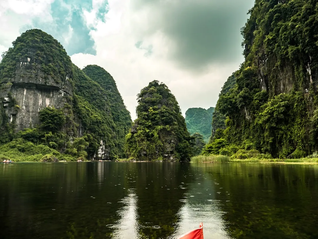 Kayaking through limestone cliffs in Halong Bay