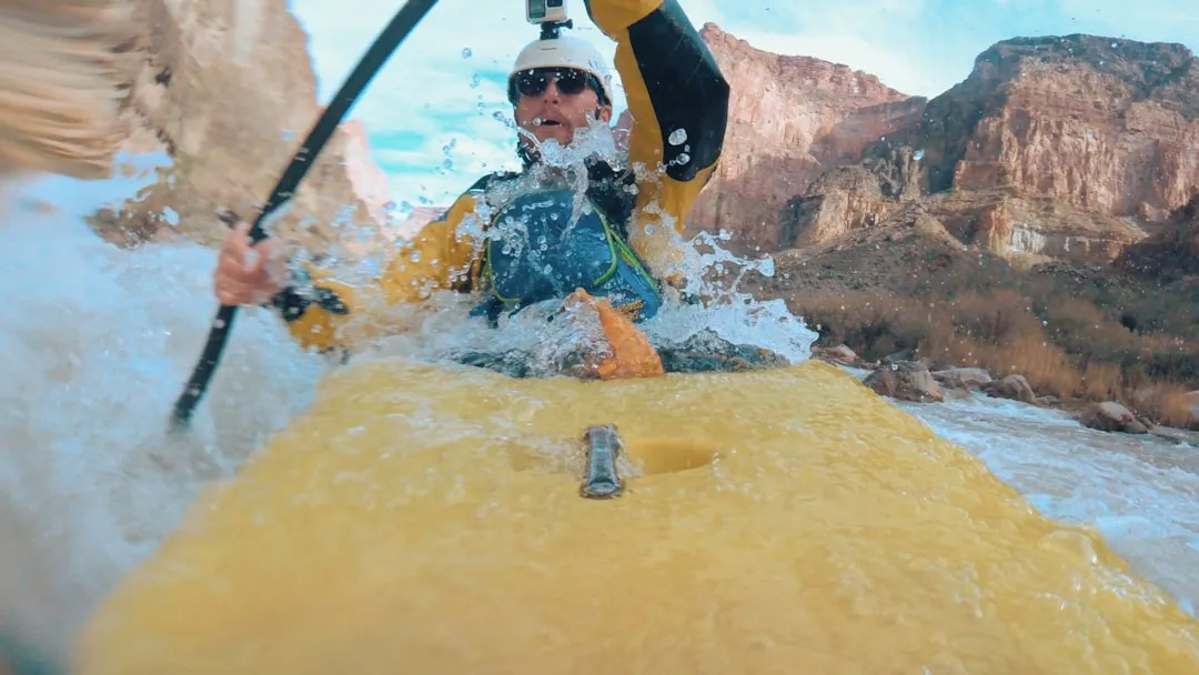 Kayaker demonstrating self-rescue technique with paddle float in cold water scenario