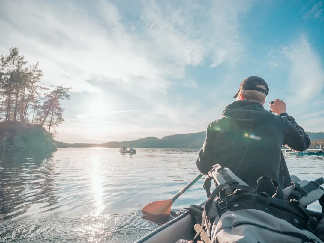 Kayak paddle and equipment arranged for a paddling trip