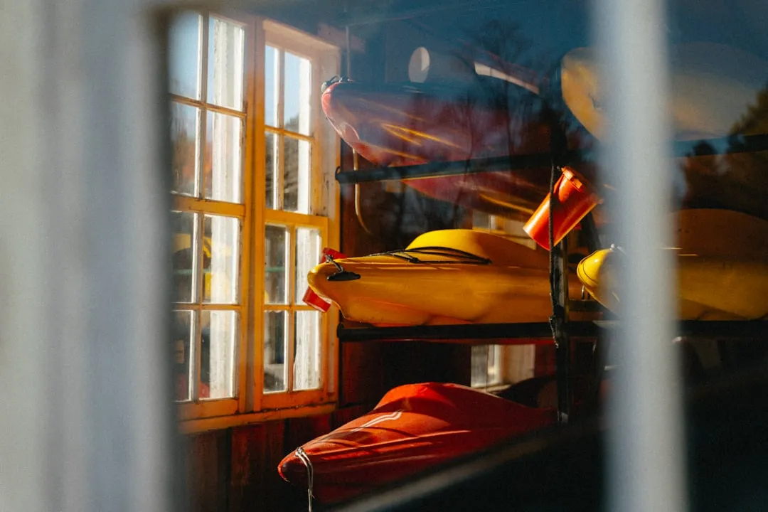 Kayak stored on wall-mounted rack