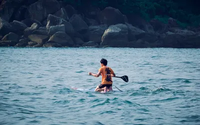 What are the advantages of kayaking over paddle boarding?