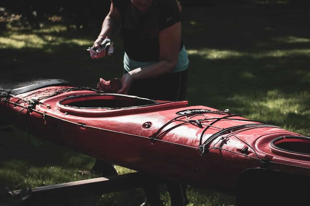 Rinsing a kayak with fresh water after saltwater outing